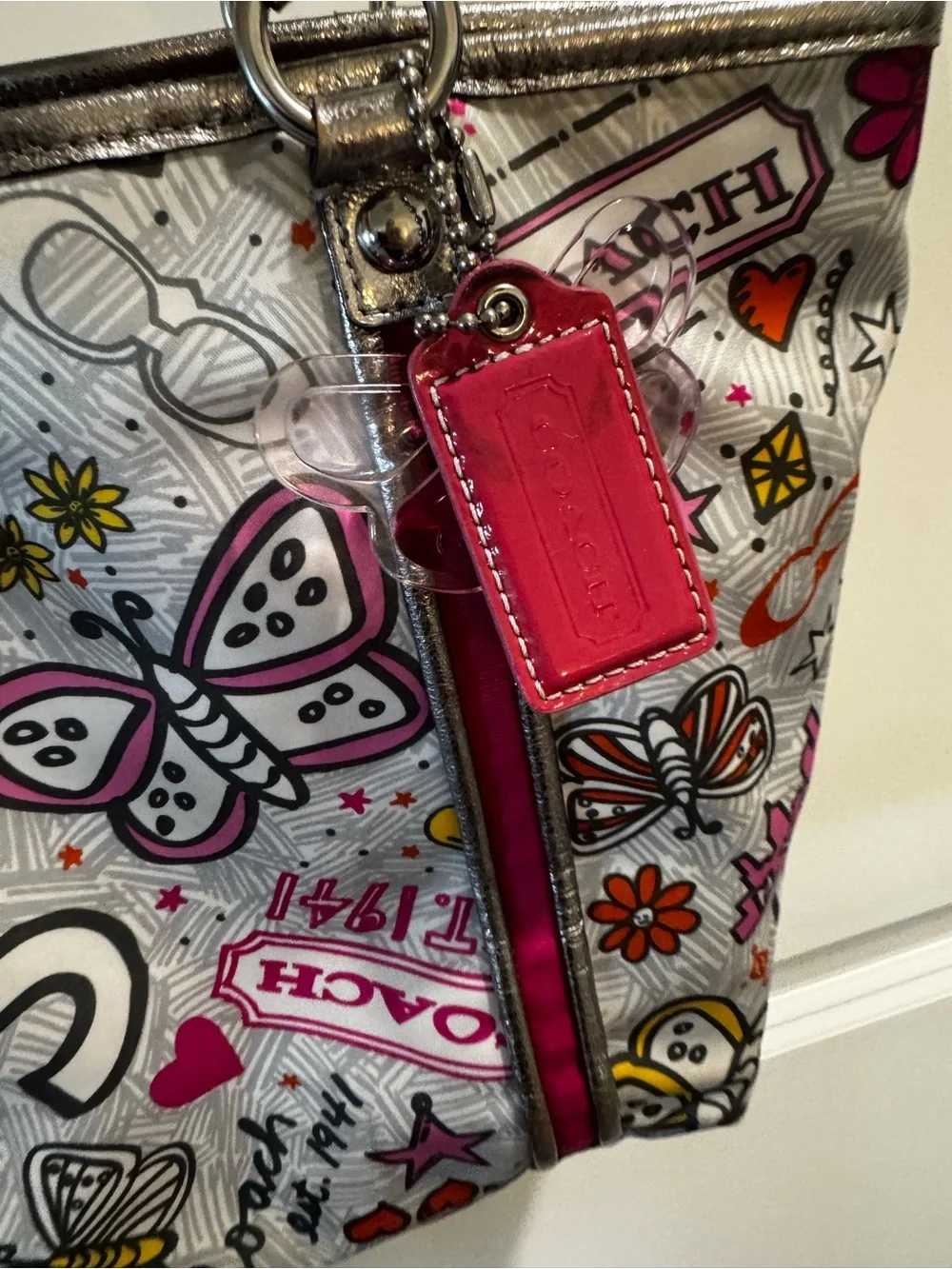 Coach Poppy Metallic Silver Tote with Pink Accent and Butterfly Print